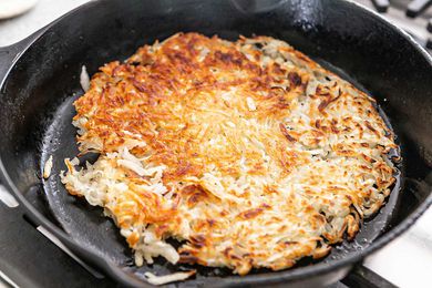 Hash Browns Cooking in a cast iron skillet
