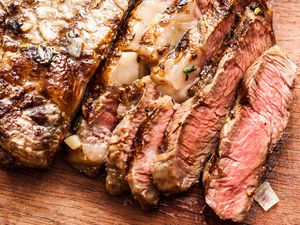 Sliced grilled steak on a cutting board