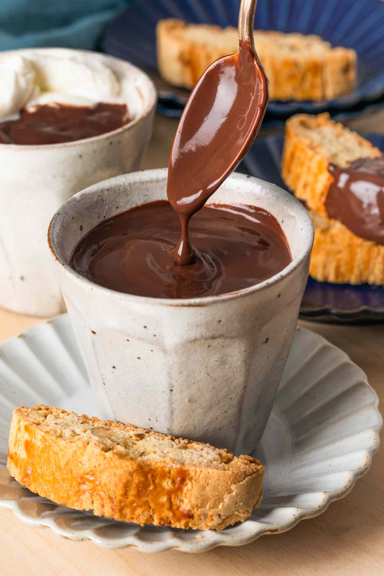 Cioccolato Caldo con Latte (Italian Hot Chocolate) in a small white mug with a spoon