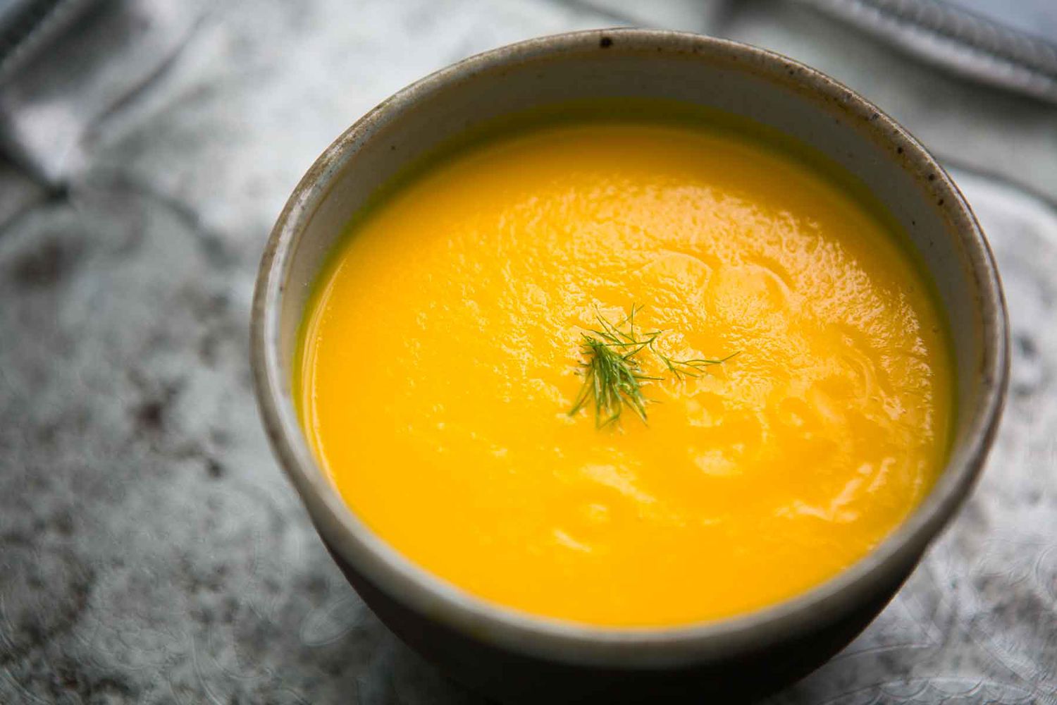A bowl of carrot ginger soup