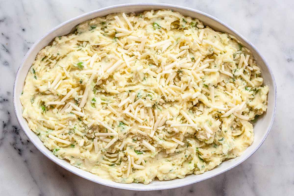 How to Make Cottage Pie -- White casserole dish with cheesy mashed potatoes on top