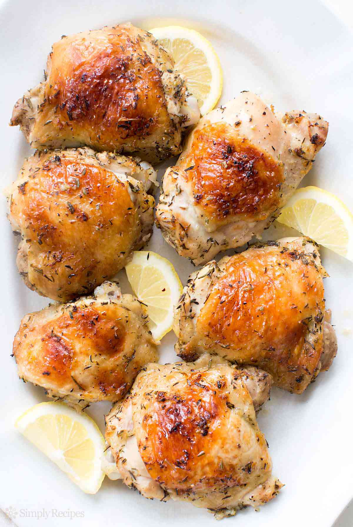 Lemon Chicken on a platter with lemon slices