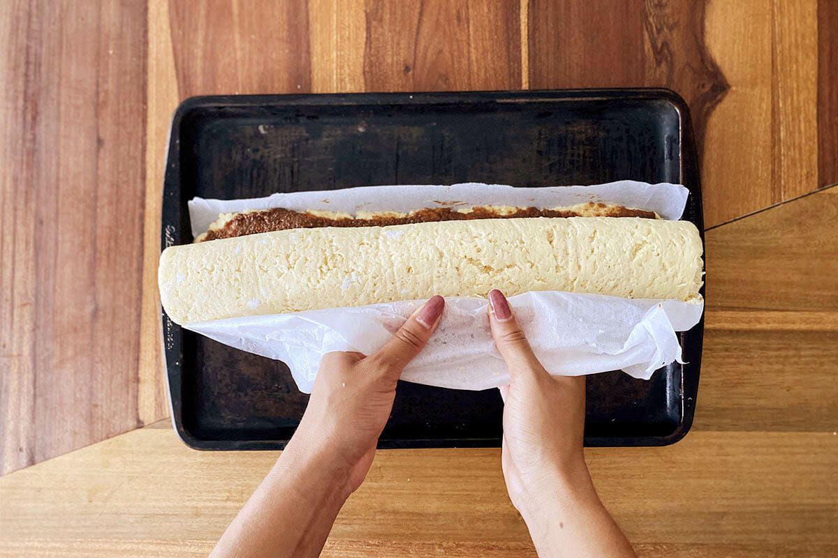 Parchment paper beingused to roll the best gluten free cinnamon rolls.