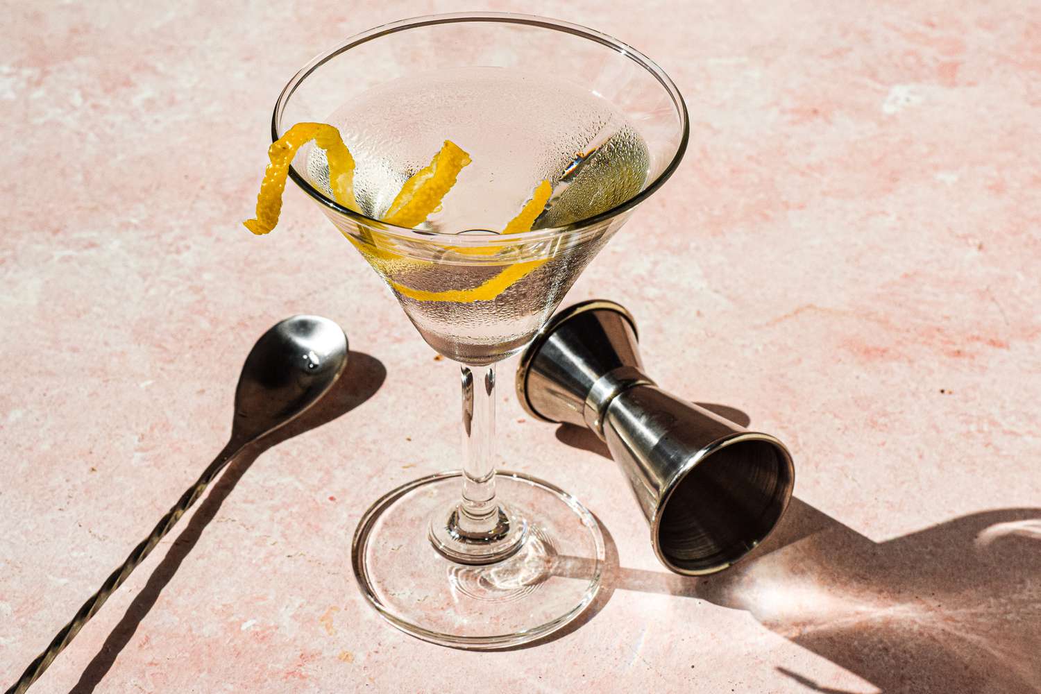 Classic martini recipe with jigger and bar spoon