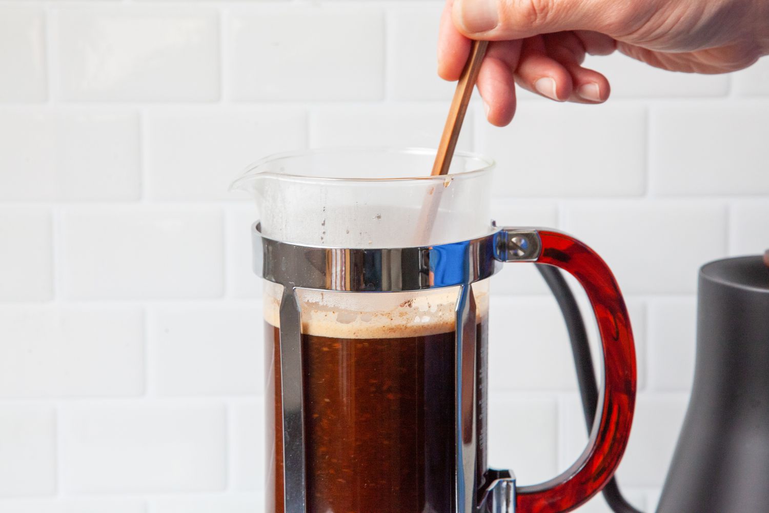 Chopstick Used to Stir Coffee Grounds and Water in the French Press
