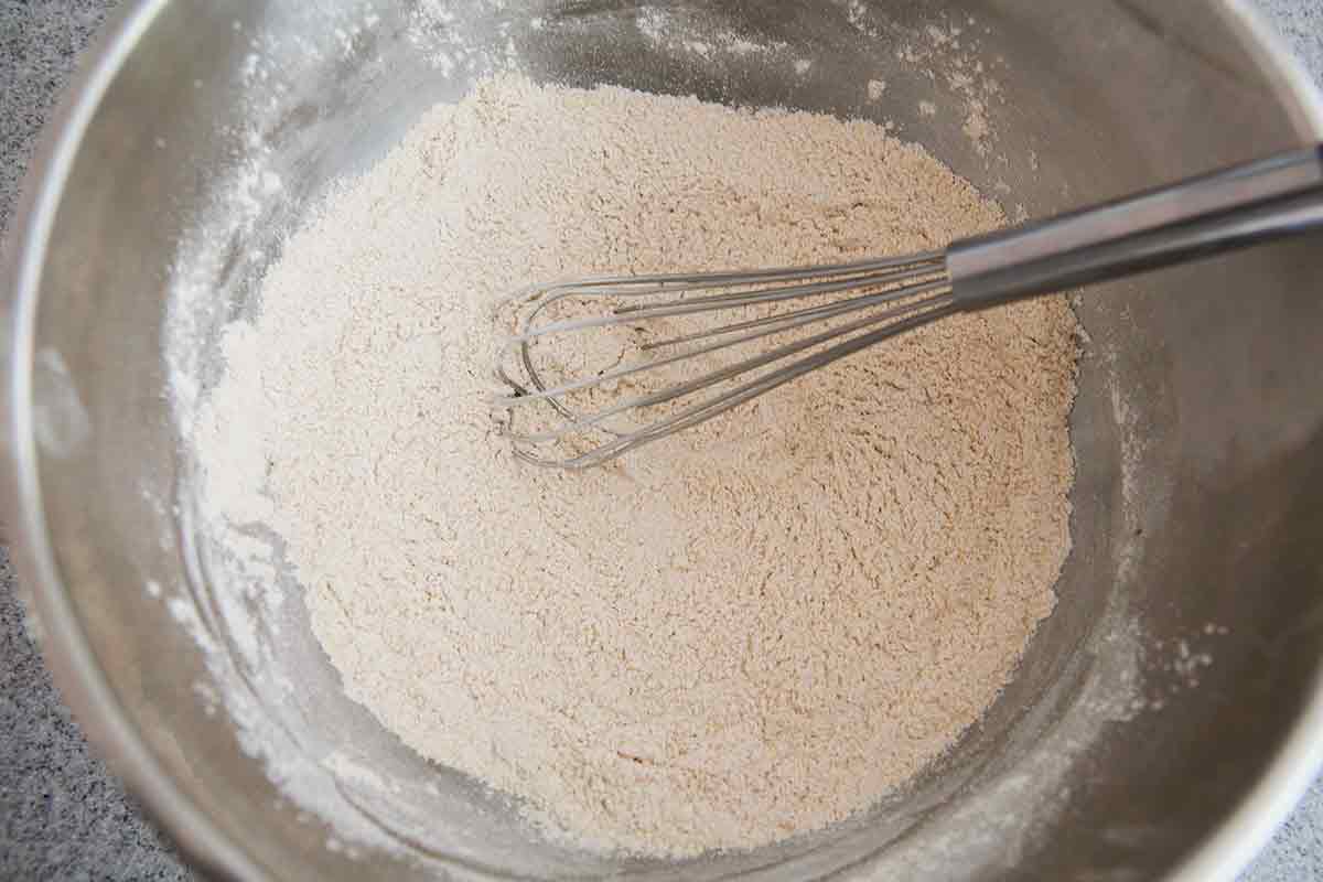 whisked pumpkin waffle dry ingredients in metal bowl
