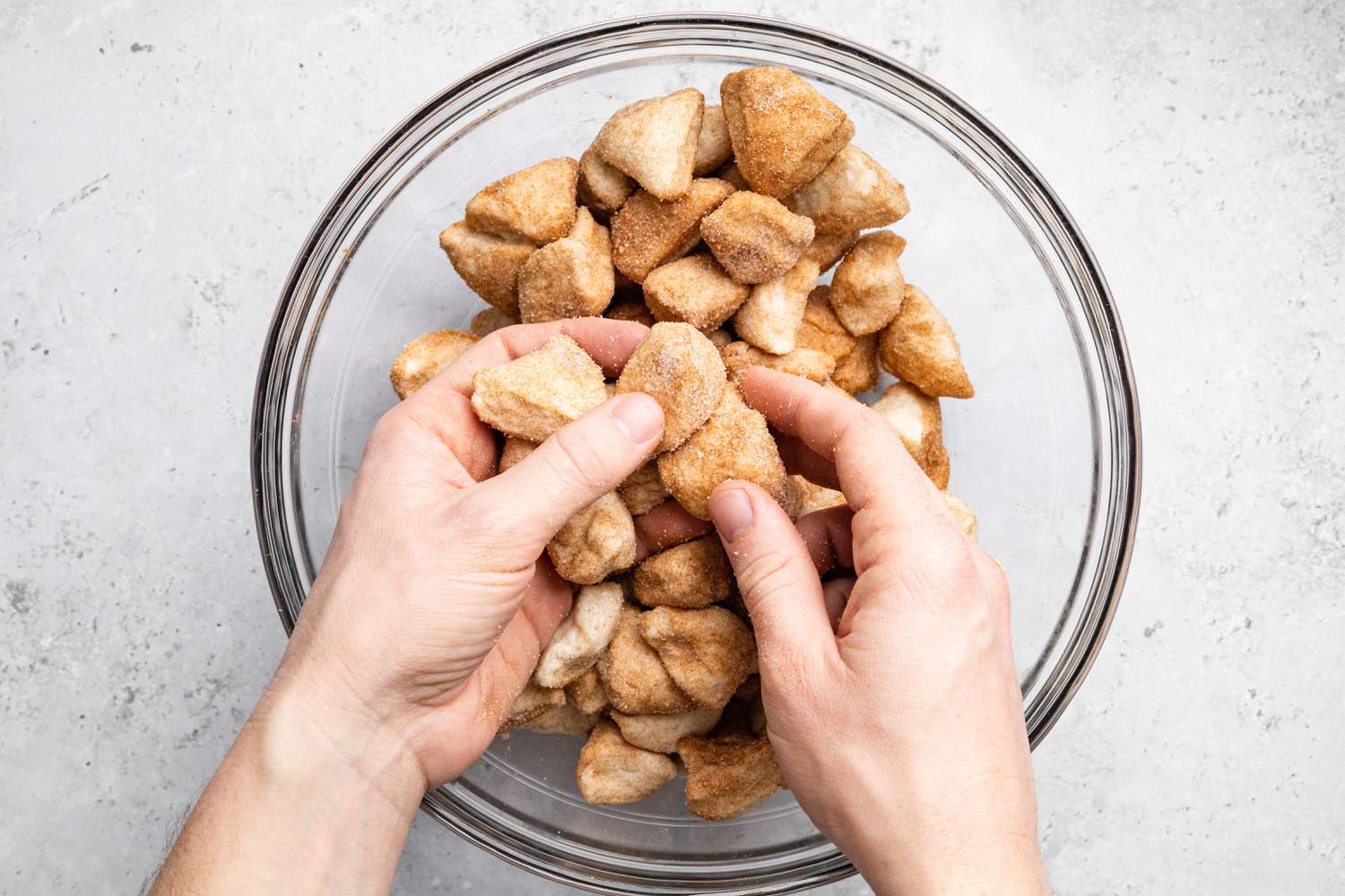 Biscuit Pieces Coated in the Cinnamon-Sugar Mixture for Easy Monkey Bread