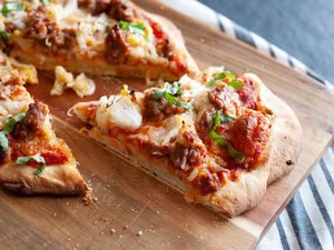 Slice of kimchi and sausage pizza.