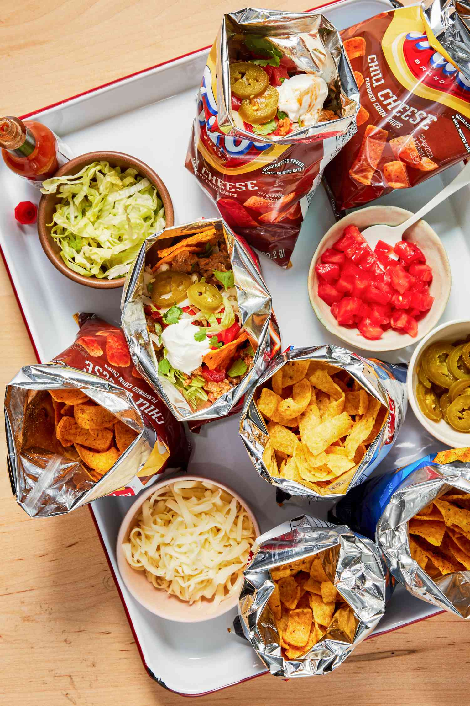 A tray with Walking Tacos and toppings