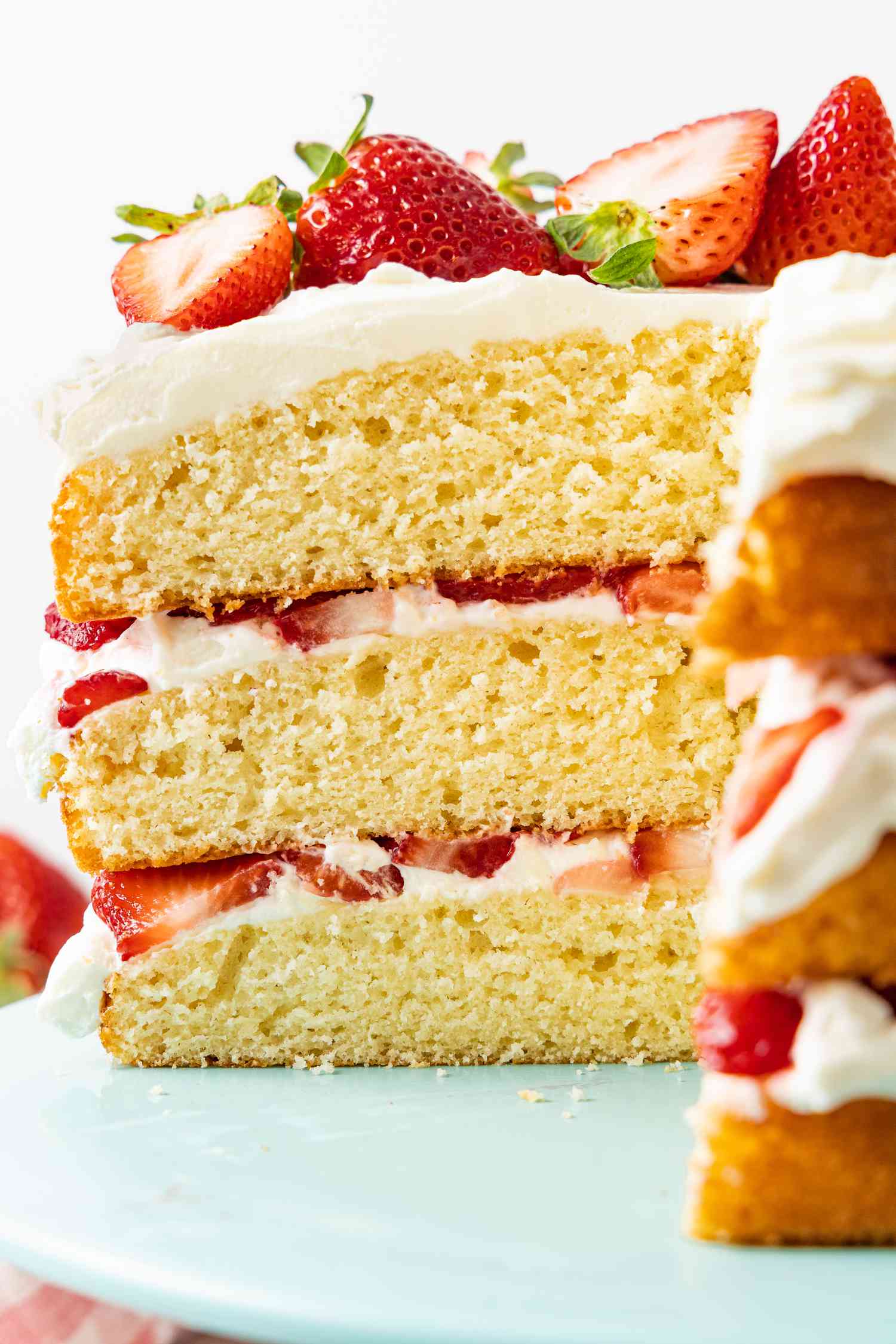 Sliced Strawberry Shortcake Cake Showcasing the Layers of the Cake (on a Cake Stand)