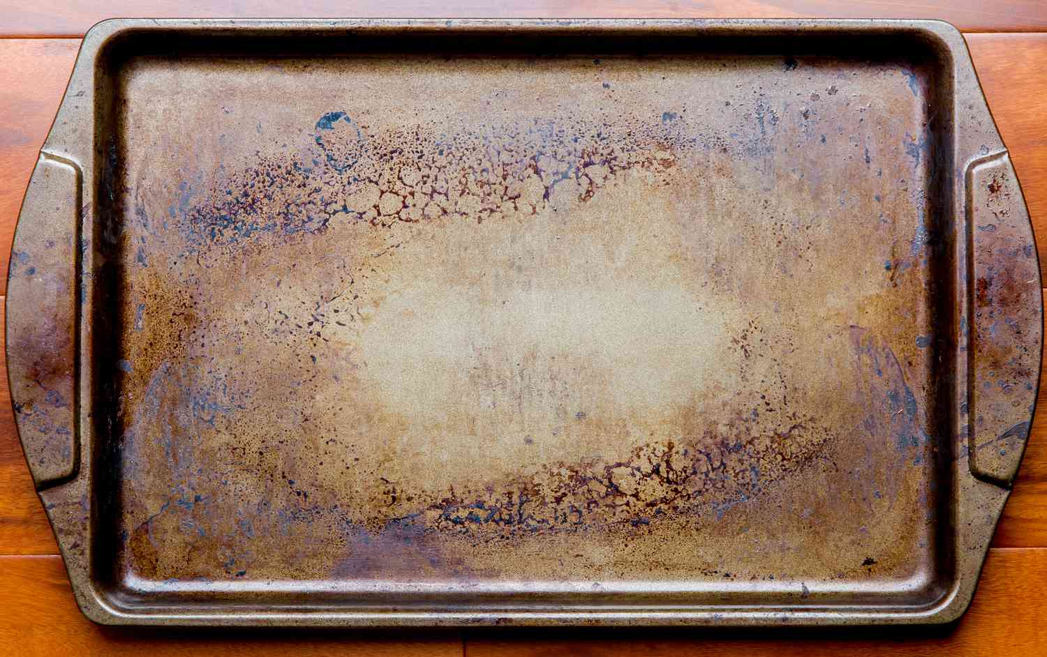 A well-used baking sheet with a dark brown patina