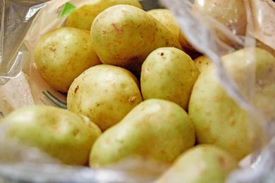 Green potatoes in a plastic bag