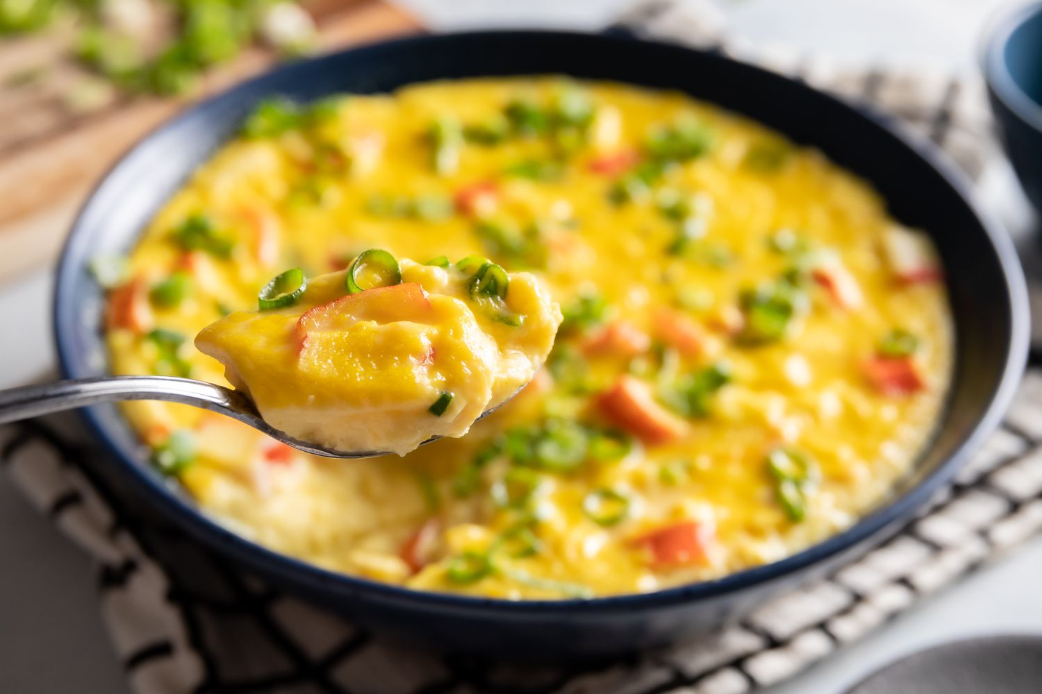 Scoop of Korean steamed eggs.