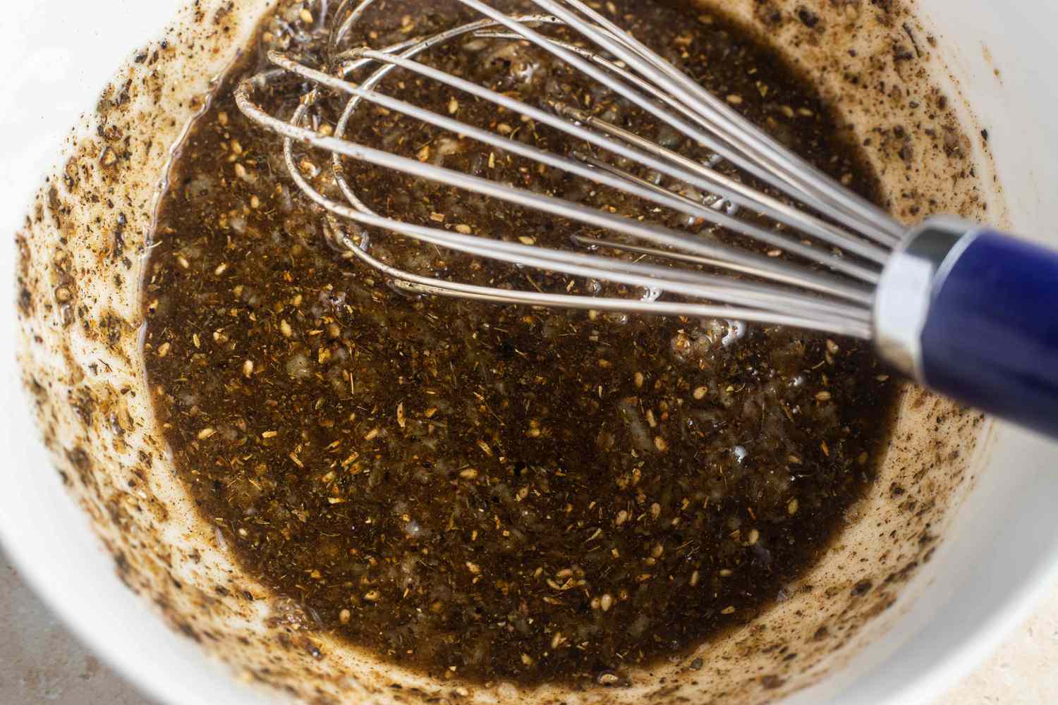 Bowl of Marinade Whisked Together For Chicken Over Rice Recipe