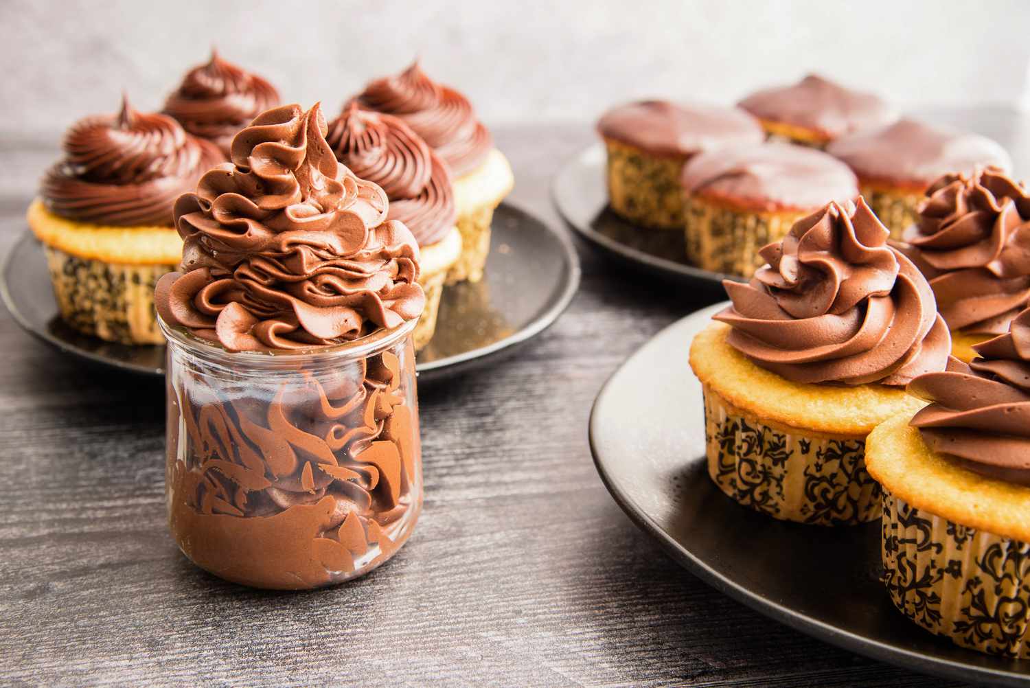 Easy chocolate ganache piped on cupcakes.