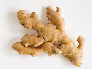 A piece of ginger root on a white background