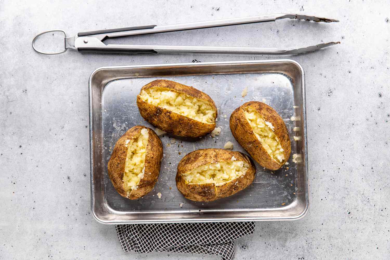 Grilled Baked Potato Opened in Half on a Tray