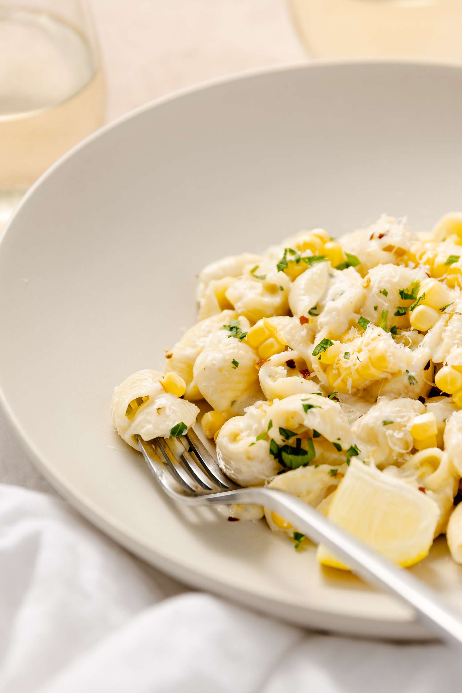 Bowl of Fresh Corn Pasta with a Fork