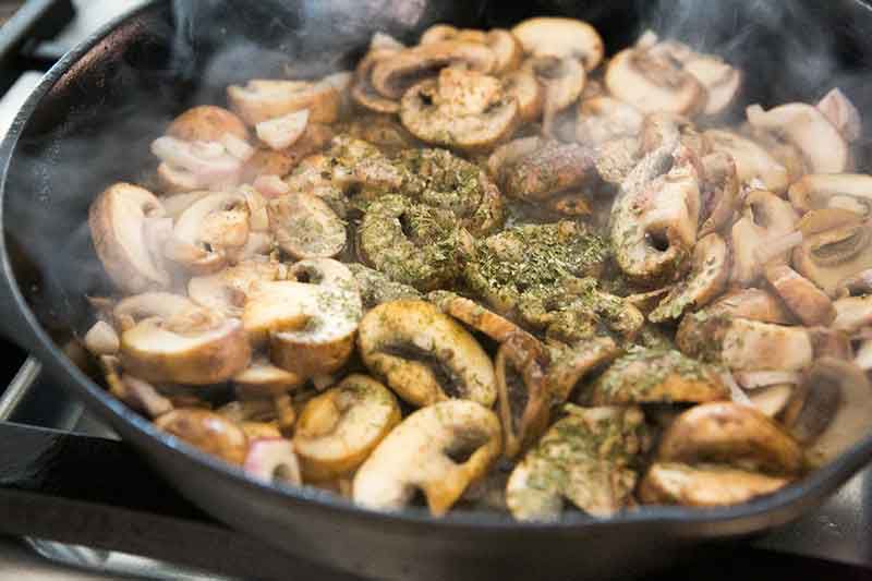 cooked and seasoned mushrooms in a pan