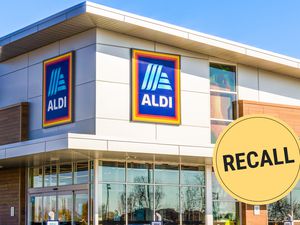 Aldi storefront image with a recall sticker
