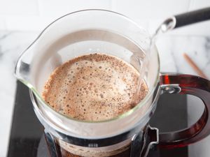 Boiling Water Poured onto Coffee Grounds in a French Press for French Press Coffee Recipe