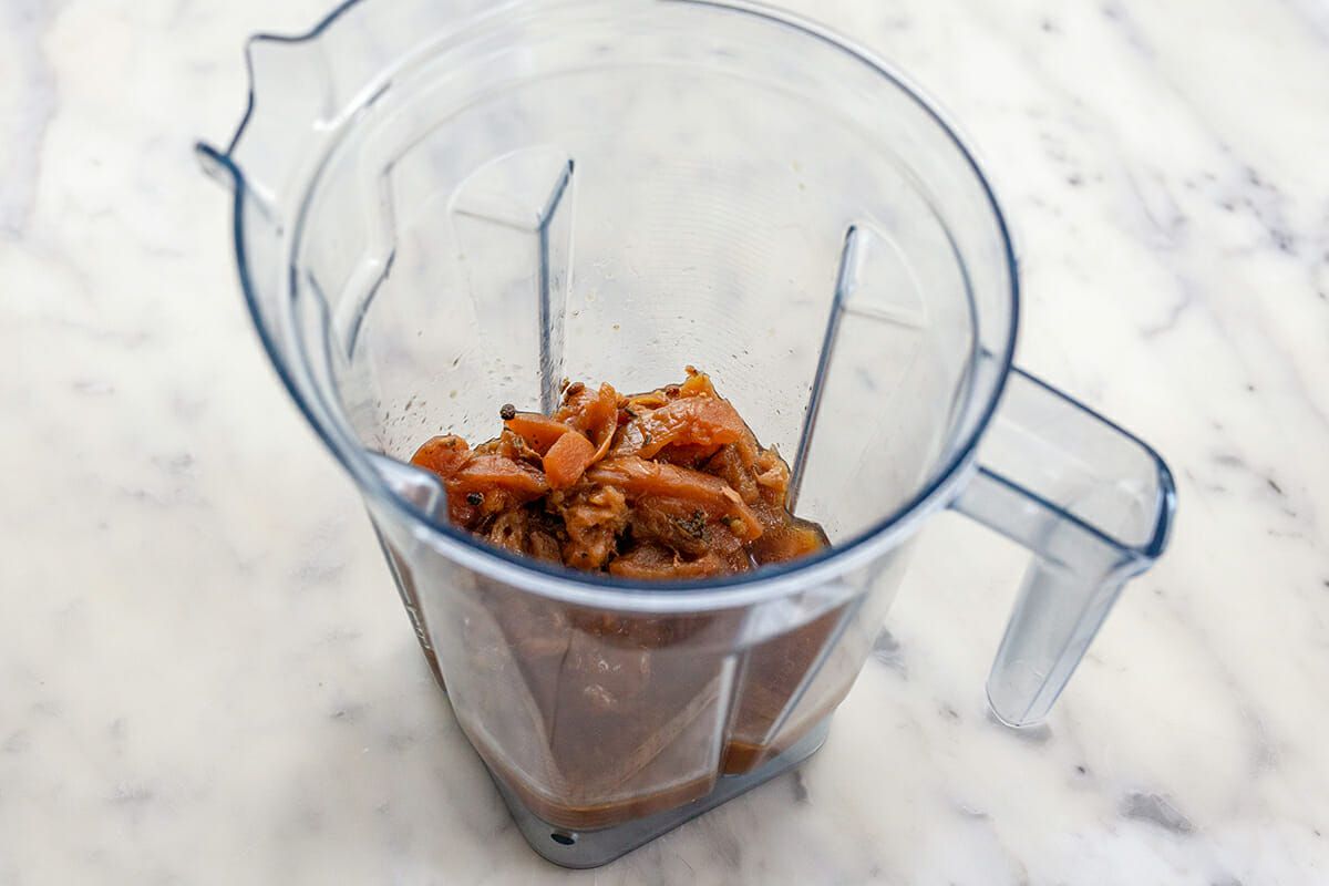 Ingredients in a blender for the sauce for a pork shoulder roast recipe.