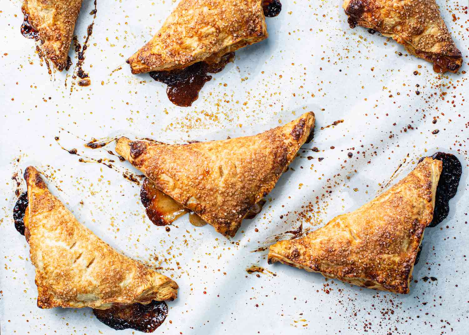 Peach hand pies on parchment paper