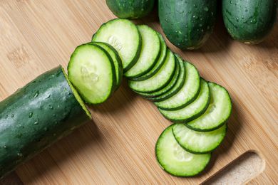 sliced cucumbers on a cutting board