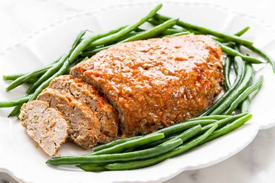 best Turkey Meatloaf cut into slices on a white platter