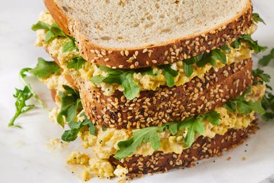 Closeup of a triple decker egg salad sandwich
