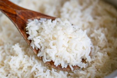 Pot of rice with a spoon in it