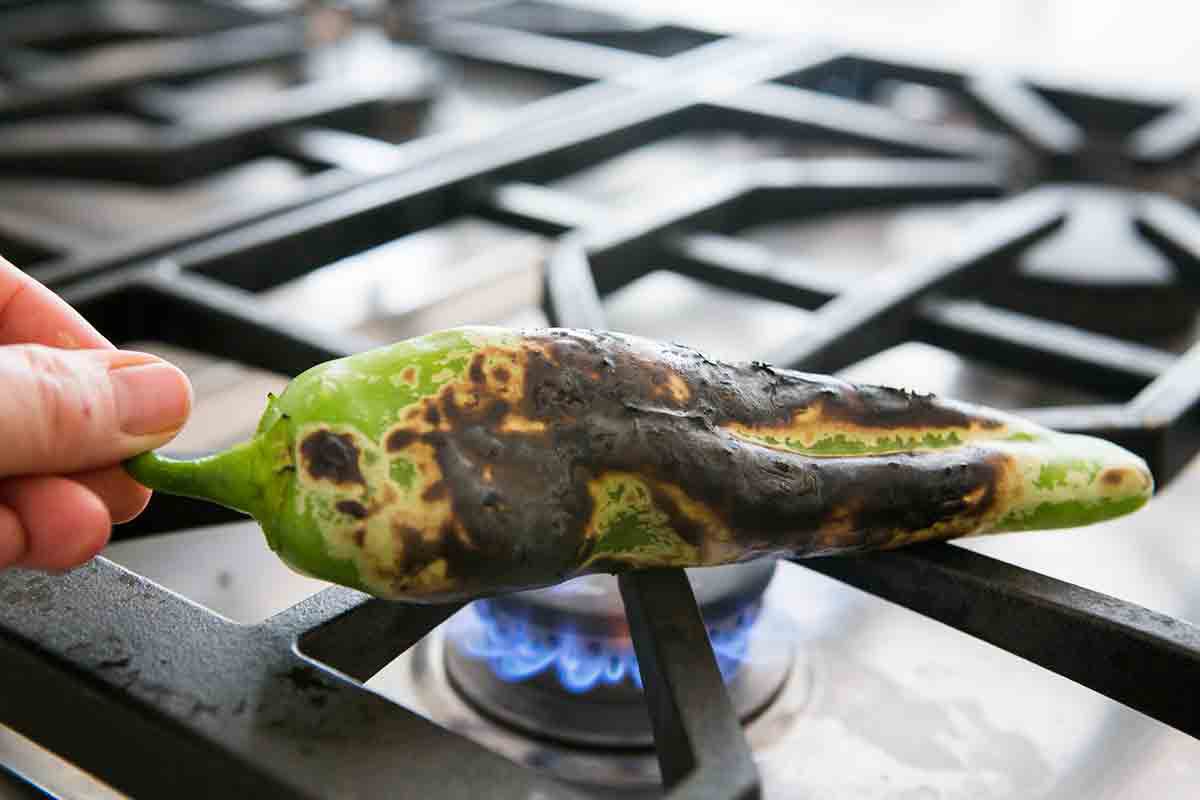 roasting green chile over open flame until charred