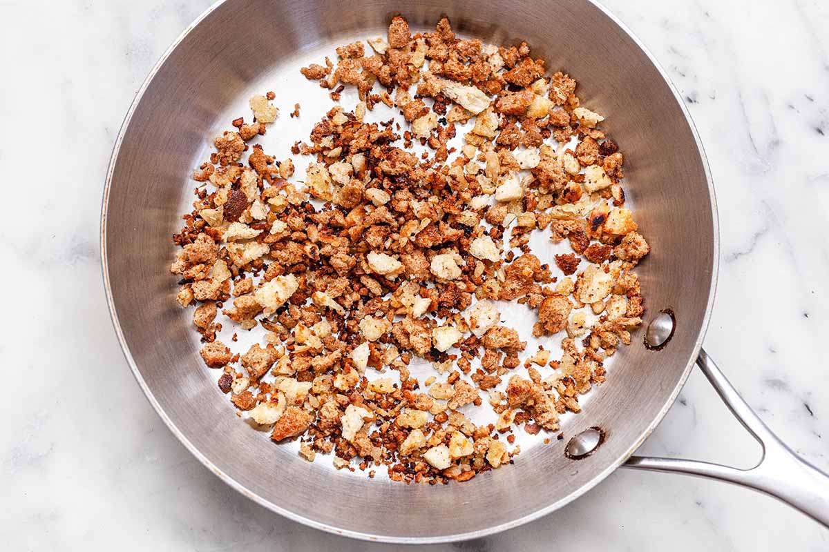 Bread Crumb Recipe - toasting breadcrumbs in a silver skillet