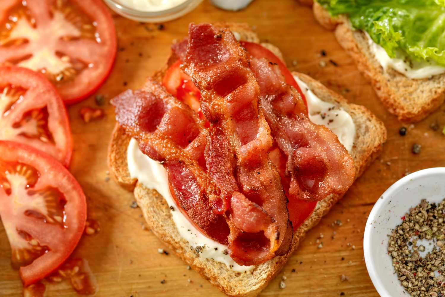 Bacon on top of BLT sandwich