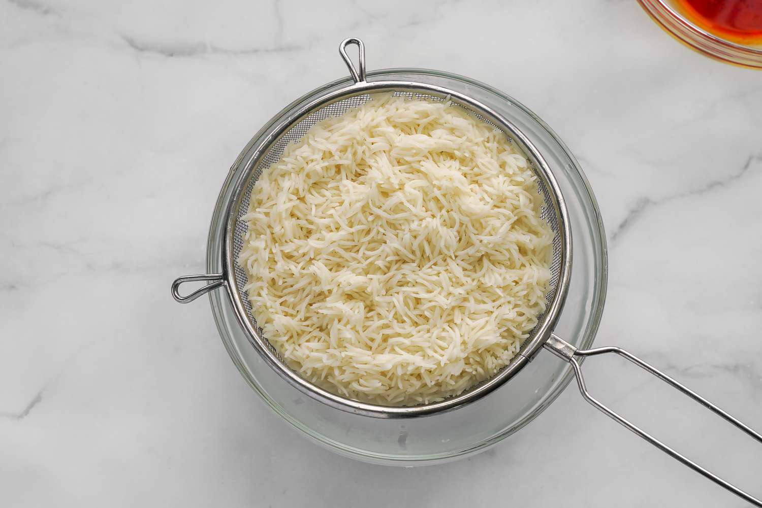 Rice Strained Over a Bowl for Sabzi Polo (Persian Herb Rice)