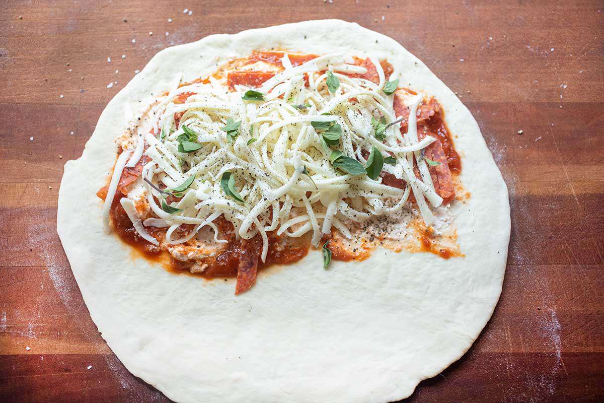 Calzone topped with cheese