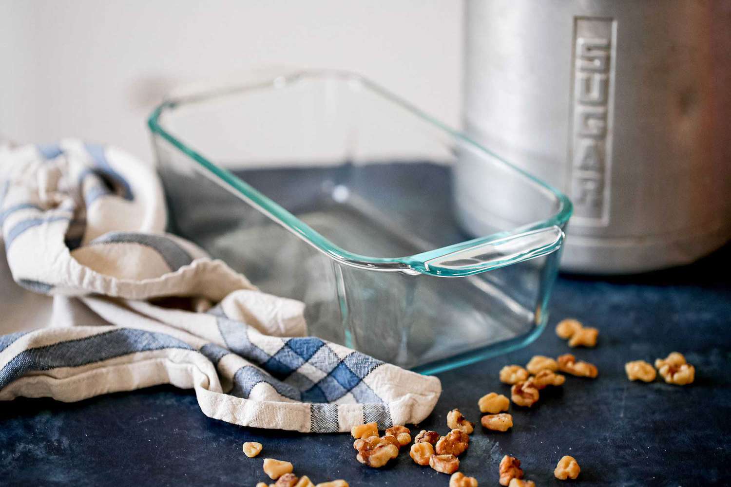 Glass Loaf Pan Guide - glass loaf pan with sugar container in the background