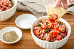 A chip dipped into Pico de Gallo.