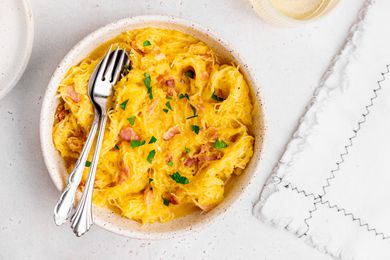 Spaghetti Squash Carbonara in a Bowl with Utensils
