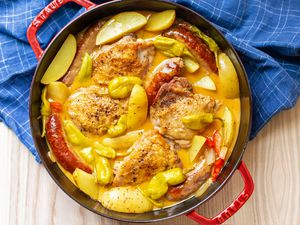 Chicken scarpariello in a red Dutch oven 