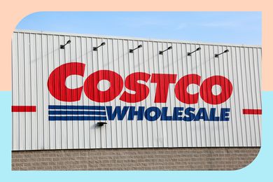 A Costco Wholesale sign on the side of a warehouse