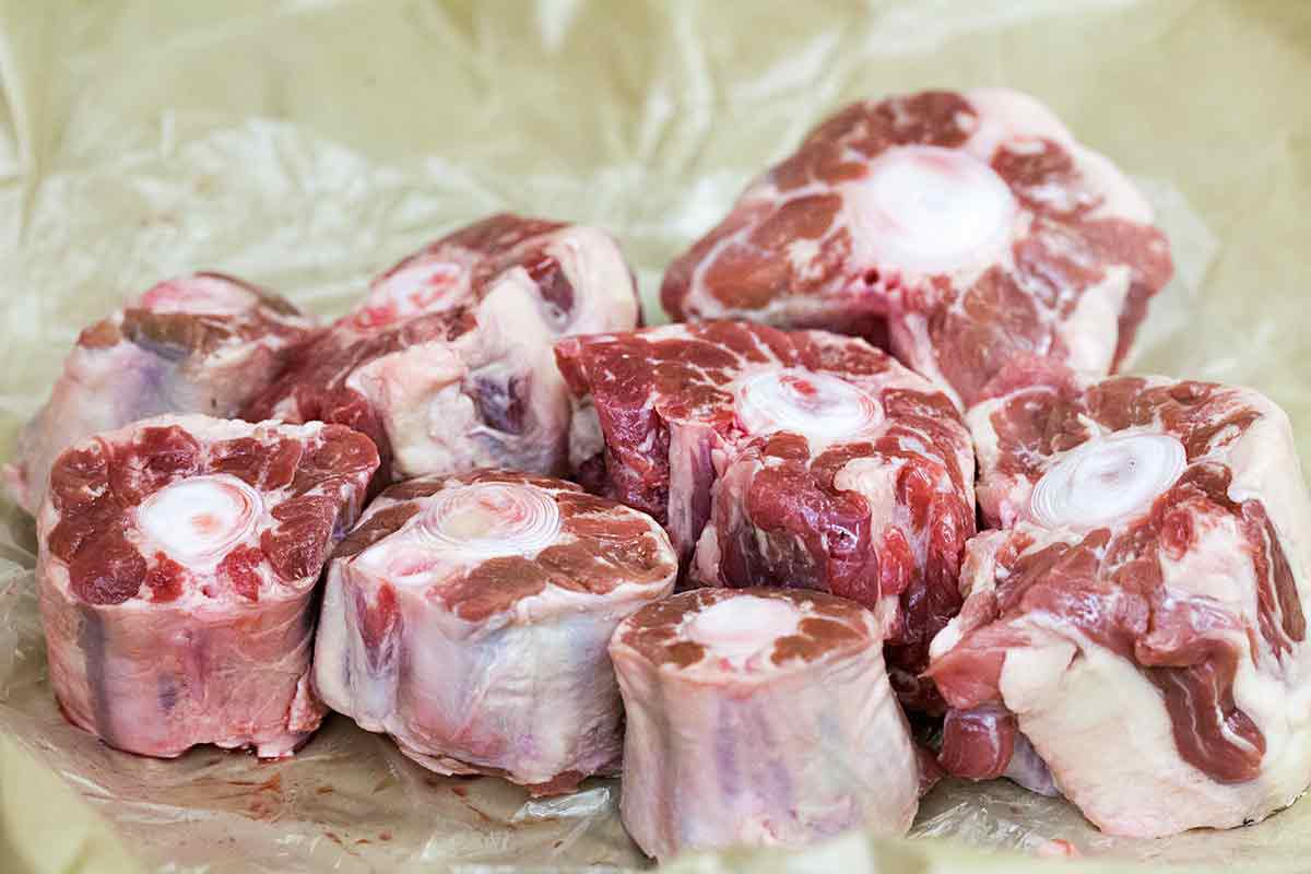 Cuts of oxtail resting on parchment paper