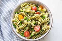 A bowl of pesto pasta salad