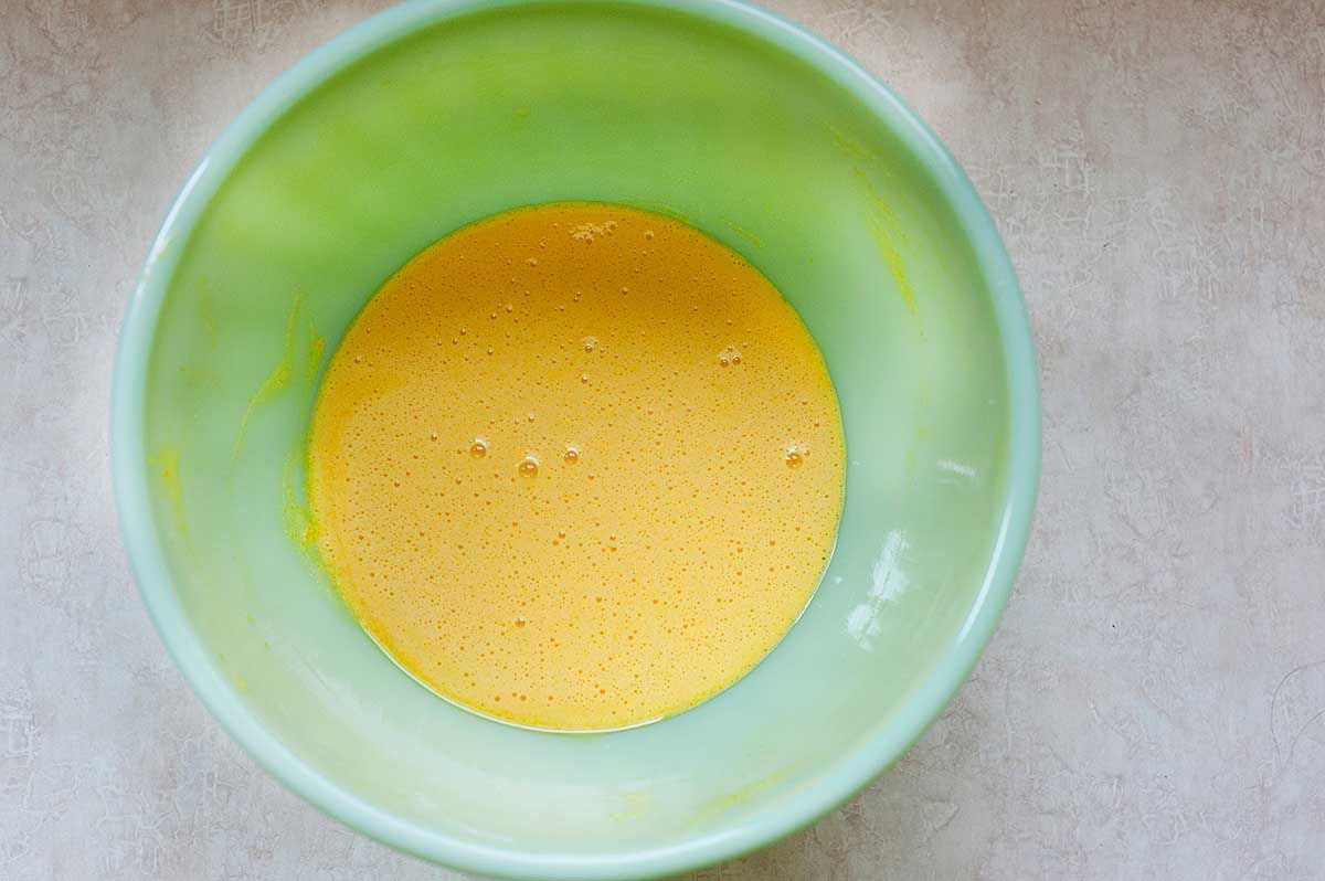 How to make Ice Cream - eggs beaten in green bowl
