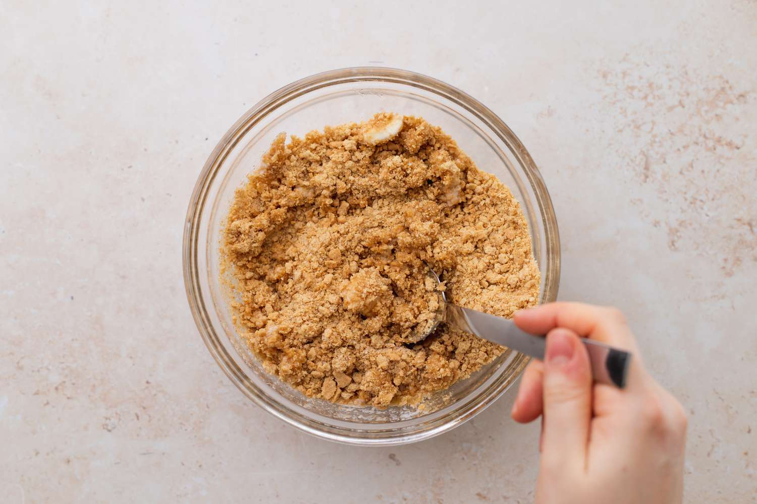 graham cracker crumbles in clear bowl for key lime bar recipe