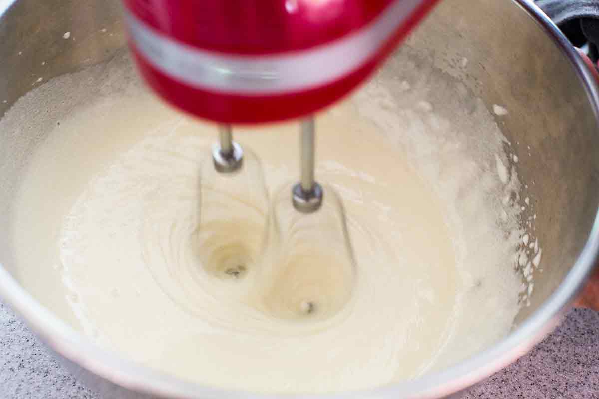 mixing bundt cake batter with a mixer