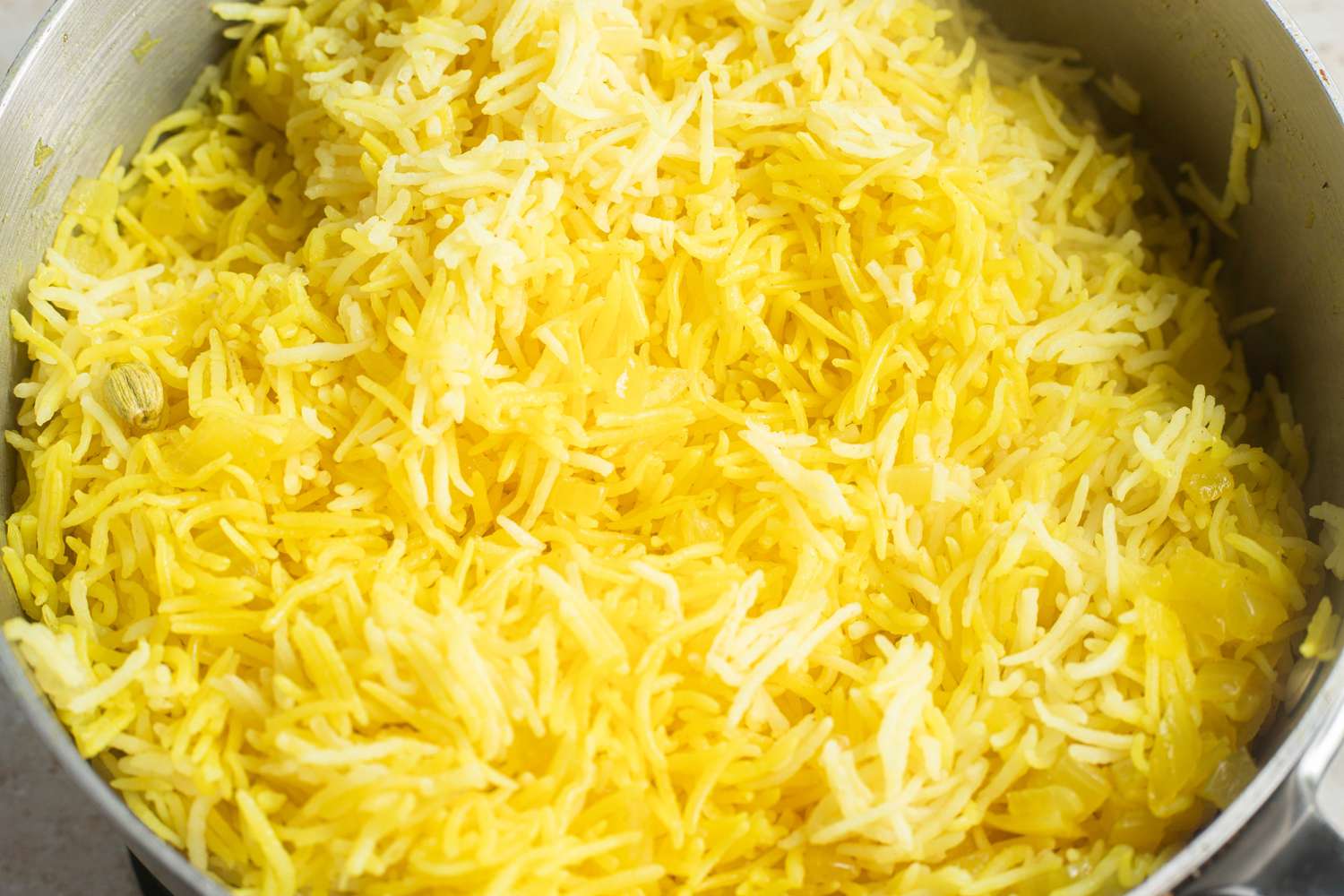 Pot of Cooked, Fluffed Turmeric Rice for New York Halal Cart-Style Chicken Over Rice Recipe