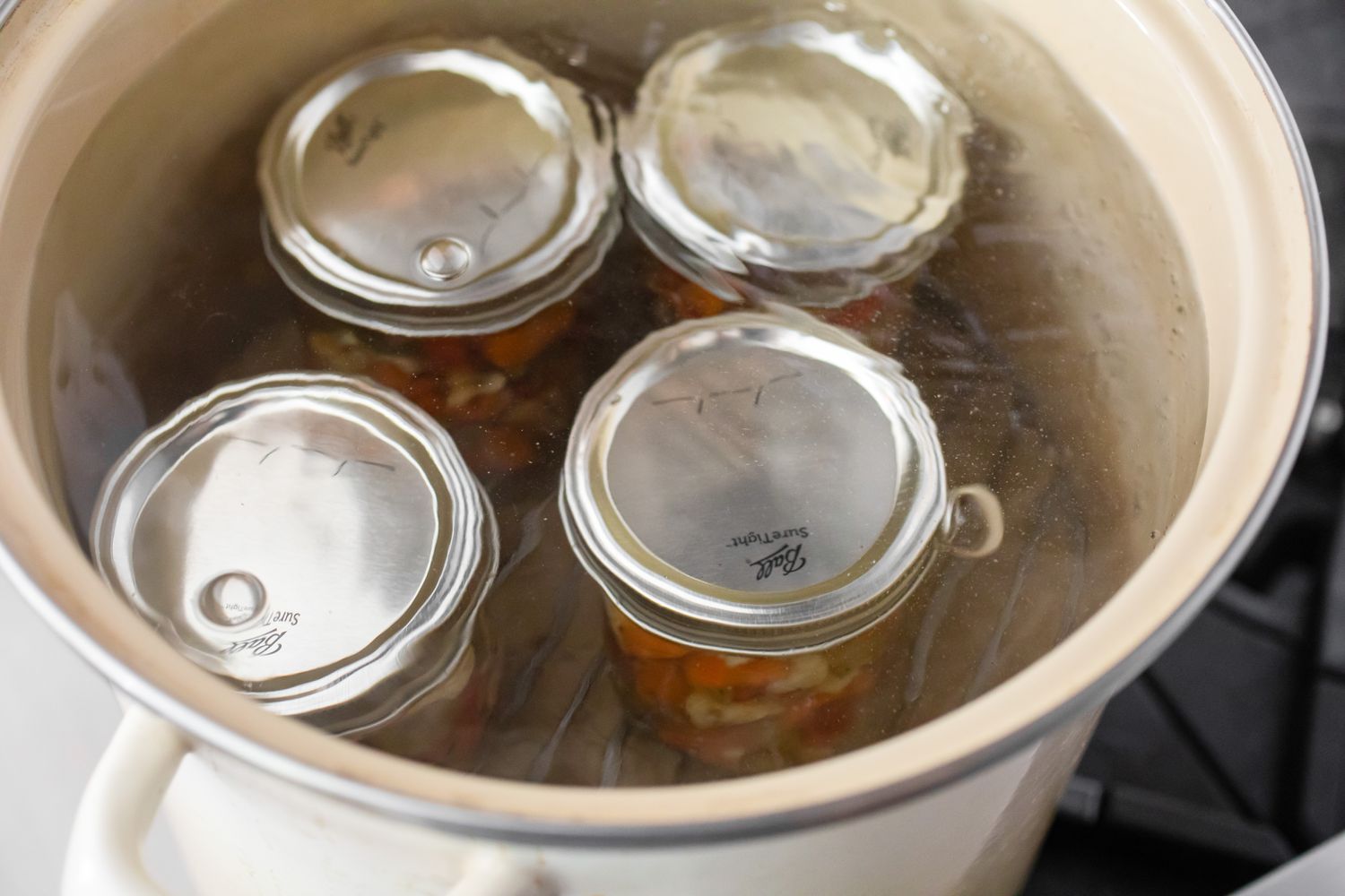 Jars of Homemade Giardiniera Boiling in Water