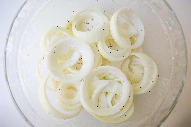 homemade onion rings coated and ready to fry