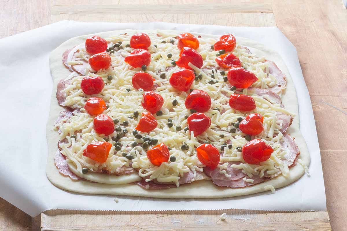 Layer the cheese and peppadews over the meat for the stromboli